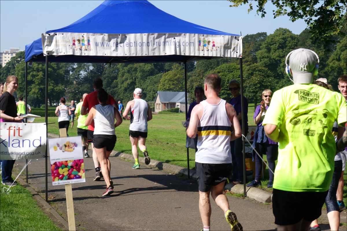 photo of runners crossing the finish line of the Kirkcaldy Parks Half Marathon.