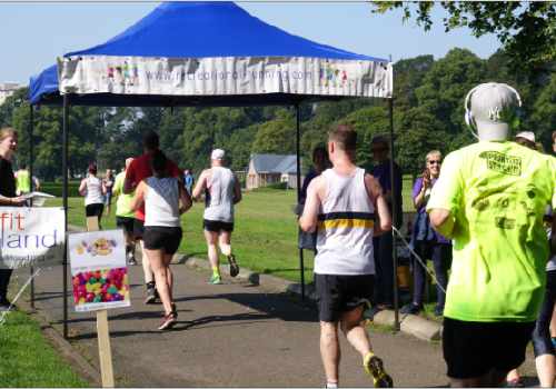 photo of runners crossing the finish line of the Kirkcaldy Parks Half Marathon.